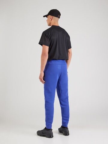 Nike Sportswear Tapered Broek 'TCH FLC' in Blauw
