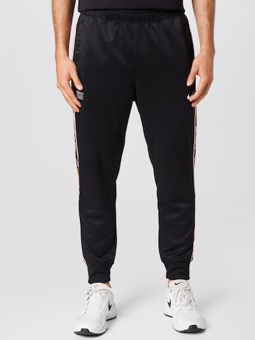 Nike Sportswear Дънки Tapered Leg Панталон в черно: отпред