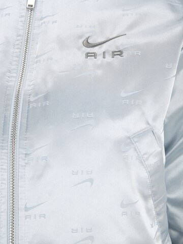 Nike Sportswear Prehodna jakna | siva barva