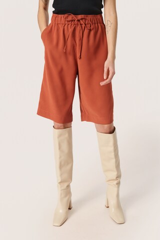 SOAKED IN LUXURY Loose fit Pants 'Shirley' in Orange: front