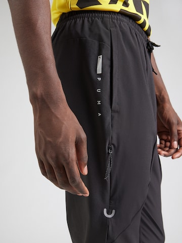 PUMA Tapered Sportbroek 'FLEX' in Zwart