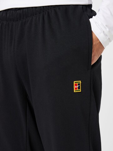 NIKE Tapered Sportbroek in Zwart