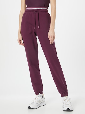 BJÖRN BORG Tapered Sports trousers in Purple: front