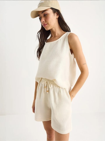 Pantalons de tailleur Bianco Lucci en beige