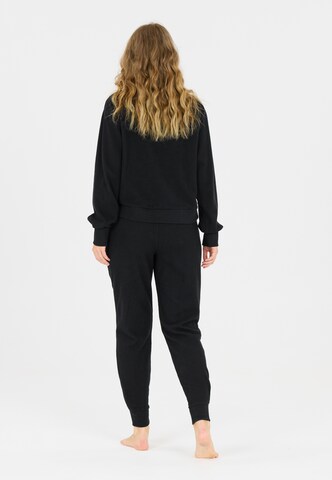 Athlecia Regular Sports trousers in Black