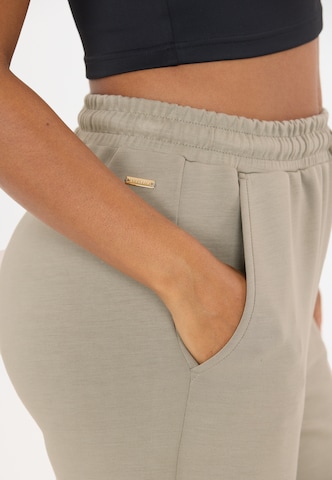 Athlecia Tapered Sports trousers 'Jacey' in Brown