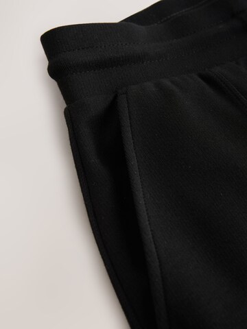 Wide leg Pantaloni di Next in nero