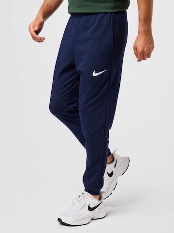 Effilé Pantalon de sport NIKE en bleu : devant