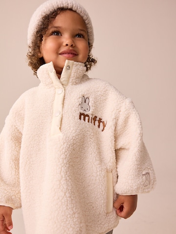 Next Fleecetakki värissä beige