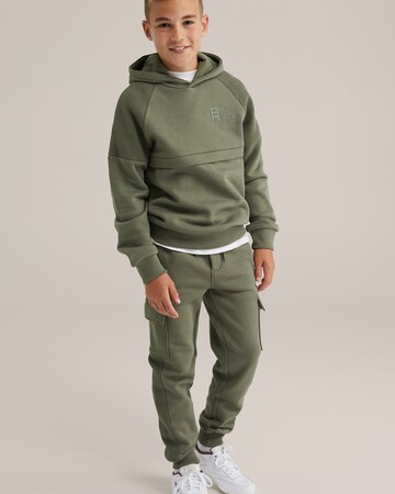 WE Fashion Конический (Tapered) Штаны в Зеленый