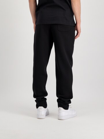 juoda ALPHA INDUSTRIES Siaurėjantis Kelnės