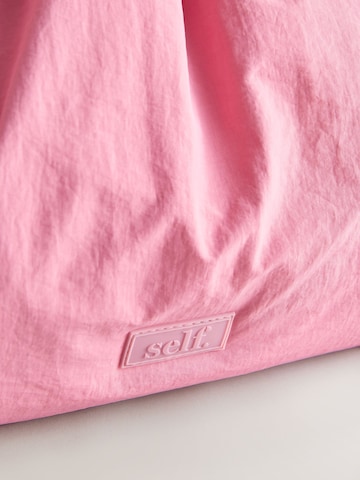 Borsa a mano di self. in rosa