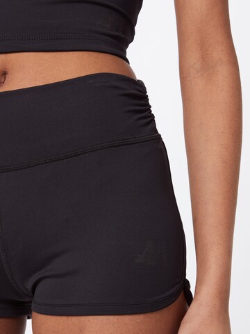 Skinny Pantalon de sport CURARE Yogawear en noir