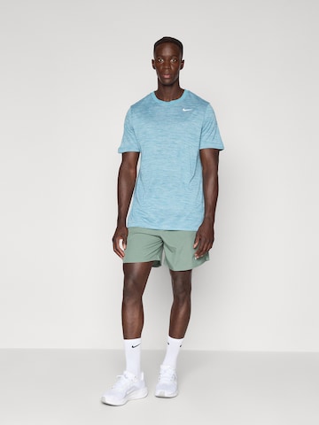 T-Shirt fonctionnel 'NEW VENEER' NIKE en bleu