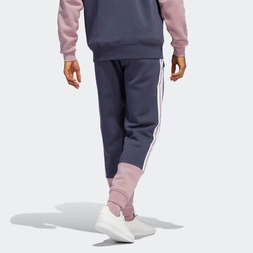 Tapered Pantaloni di ADIDAS ORIGINALS in blu