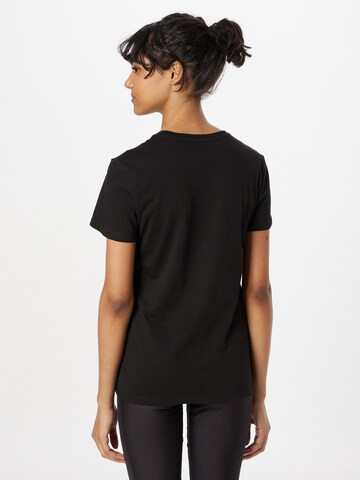 PUMA - Camiseta funcional 'Essentials+' en negro