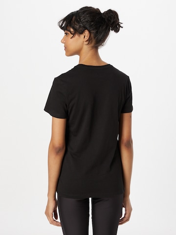 PUMA Performance Shirt 'Essentials+' in Black
