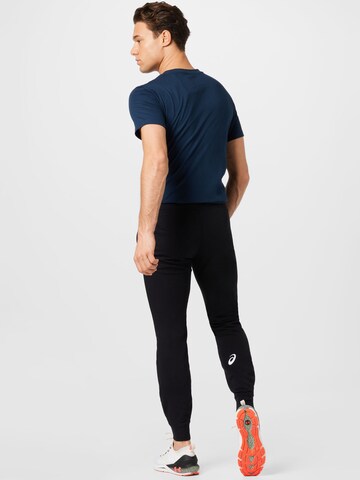 Tapered Pantaloni sportivi di ASICS in nero