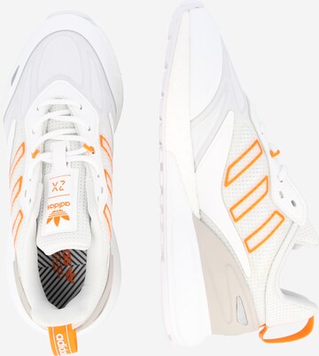 Baskets basses 'ZX 2K BOOST 2.0' ADIDAS ORIGINALS en blanc