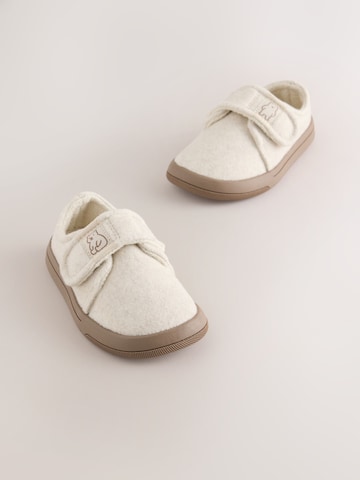 Neonato di Next in beige