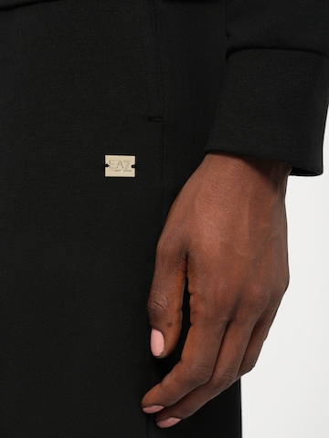 Tuta da jogging di EA7 Emporio Armani in nero