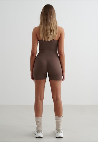 Skinny Pantaloni sportivi di Aim'n in marrone