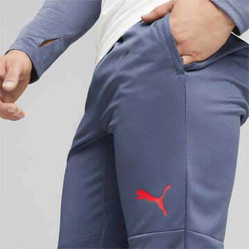 PUMA Slimfit Sportbroek 'IndividualCUP' in Blauw