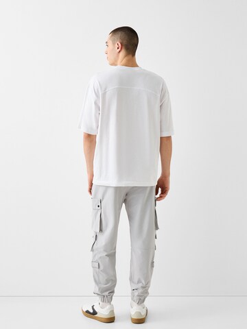 Tapered Pantaloni cargo di Bershka in grigio