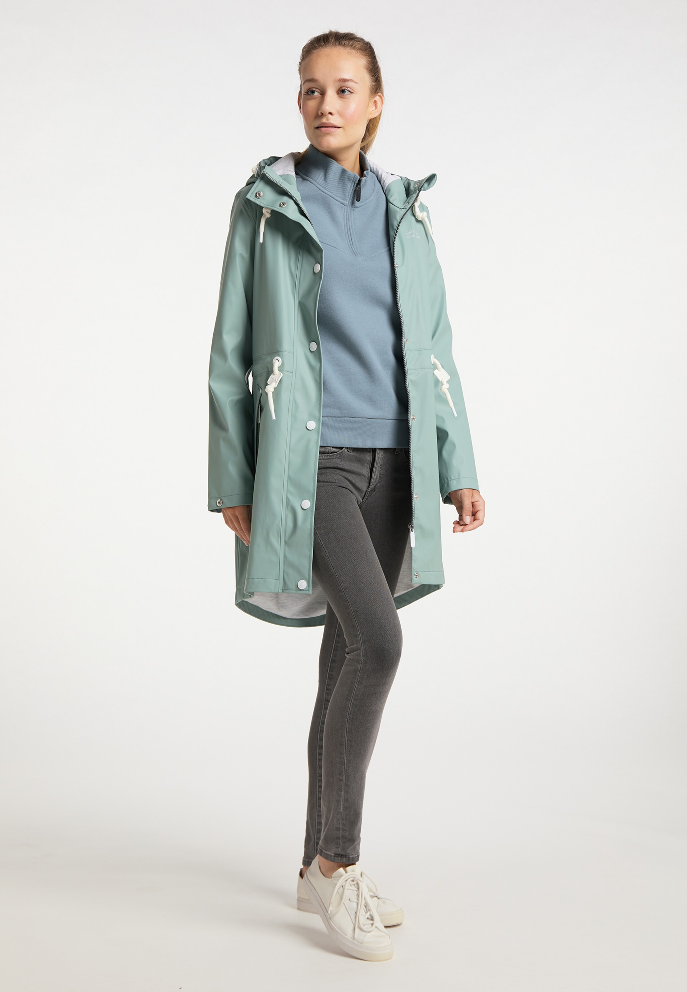 mint green raincoat