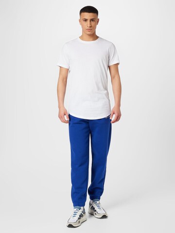 Champion Authentic Athletic Apparel Tapered Sportbroek in Blauw