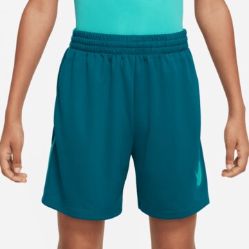 NIKE Loose fit Sports trousers in Blue