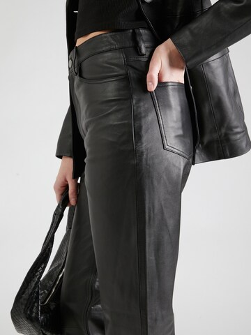 REMAIN Regular Trousers in Black