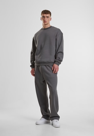 Urban ClassicsLoosefit Hlače - siva boja