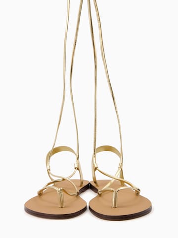 Bershka T-bar sandals in Gold