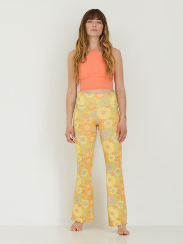 ABOUT YOU x Sofia Tsakiridou Flared Pants 'LOU' in Yellow