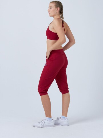 SPORTKIND Loosefit Sporthose 'Caprihose mit Taschen'‌‌‌‌‌ in Rot