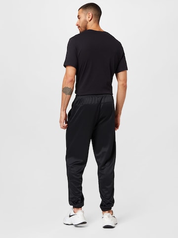 Nike Sportswear Дънки Tapered Leg Панталон в черно