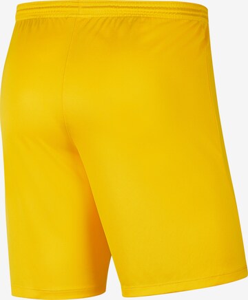 NIKE Regular Workout Pants in Yellow