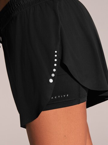 Next - Loosefit Pantalón deportivo en negro