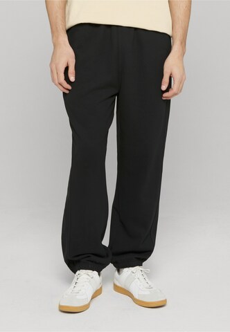 Urban Classics Loose fit Trousers in Black: front