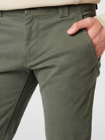 Tommy Jeans - Slimfit Calças chino 'SCANTON' em verde