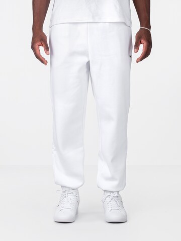 LACOSTE Tapered Workout Pants in White: front