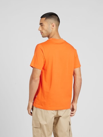new balance Koszulka w kolorze pomarańczowy