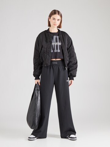 Champion Authentic Athletic Apparel - Pierna ancha Pantalón en negro