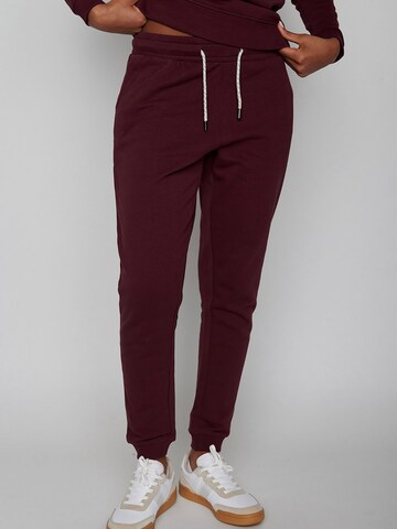 GREENBOMB Tapered Pants in Red: front