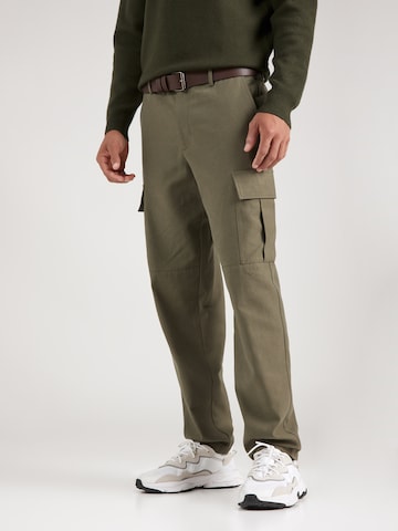 Guido Maria Kretschmer Men Tapered Pants 'Arian' in Green: front