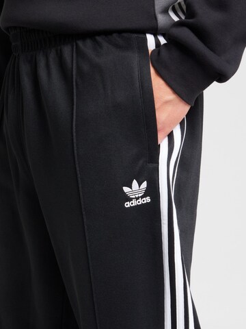 ADIDAS ORIGINALS Baggy Broek 'Adicolor Firebird' in Zwart