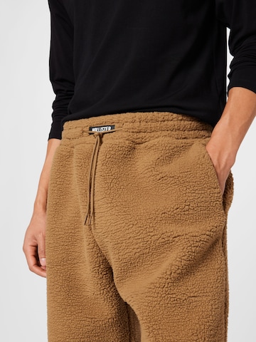 HOLLISTER Tapered Trousers 'APAC' in Brown