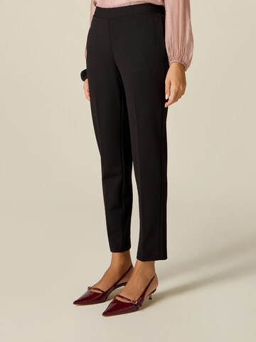 oltre - Skinny Pantalón en negro