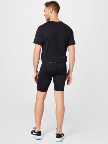 NIKE Skinny Spodnie sportowe w kolorze czarny